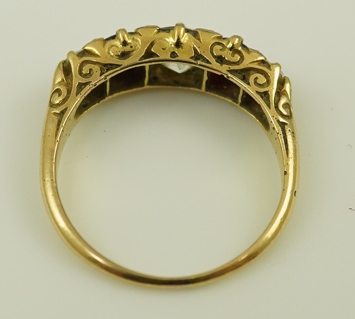 A late Victorian 18ct gold, two stone ruby and three stone diamond set half hoop ring